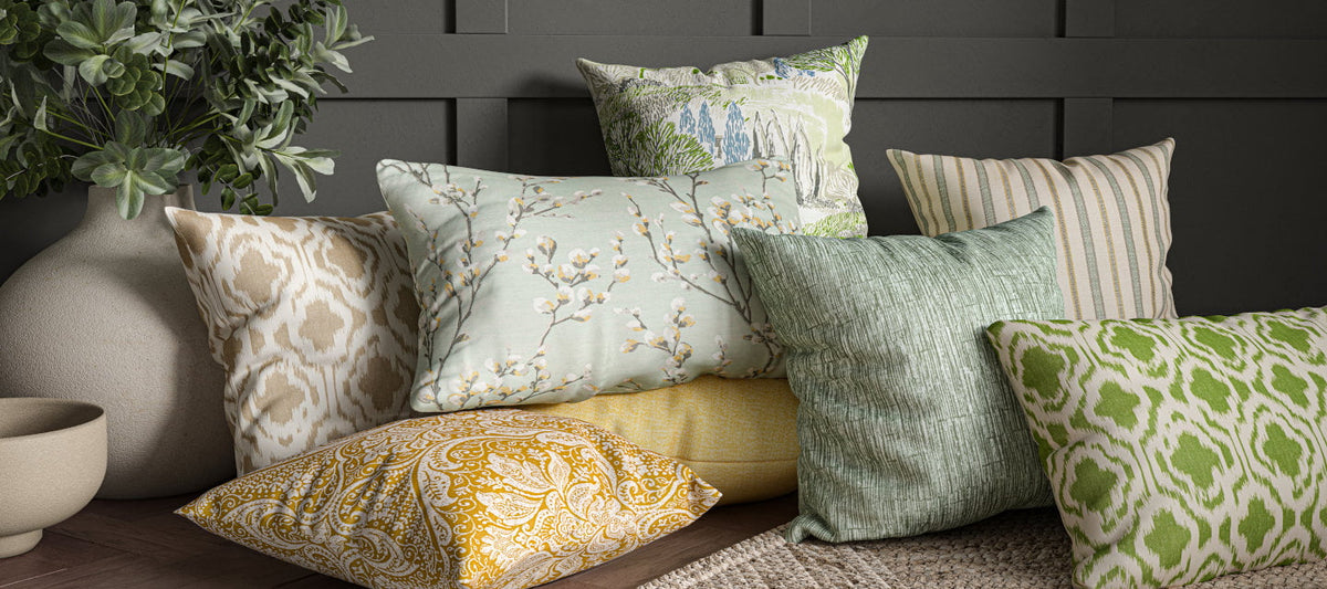 KAI Contract by Ashley Wilde fire retardant fabrics, a stack of printed Harrogate cushions