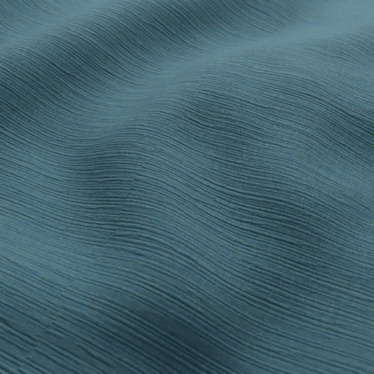Sekers Glamis Azure fire retardant curtain fabric draped