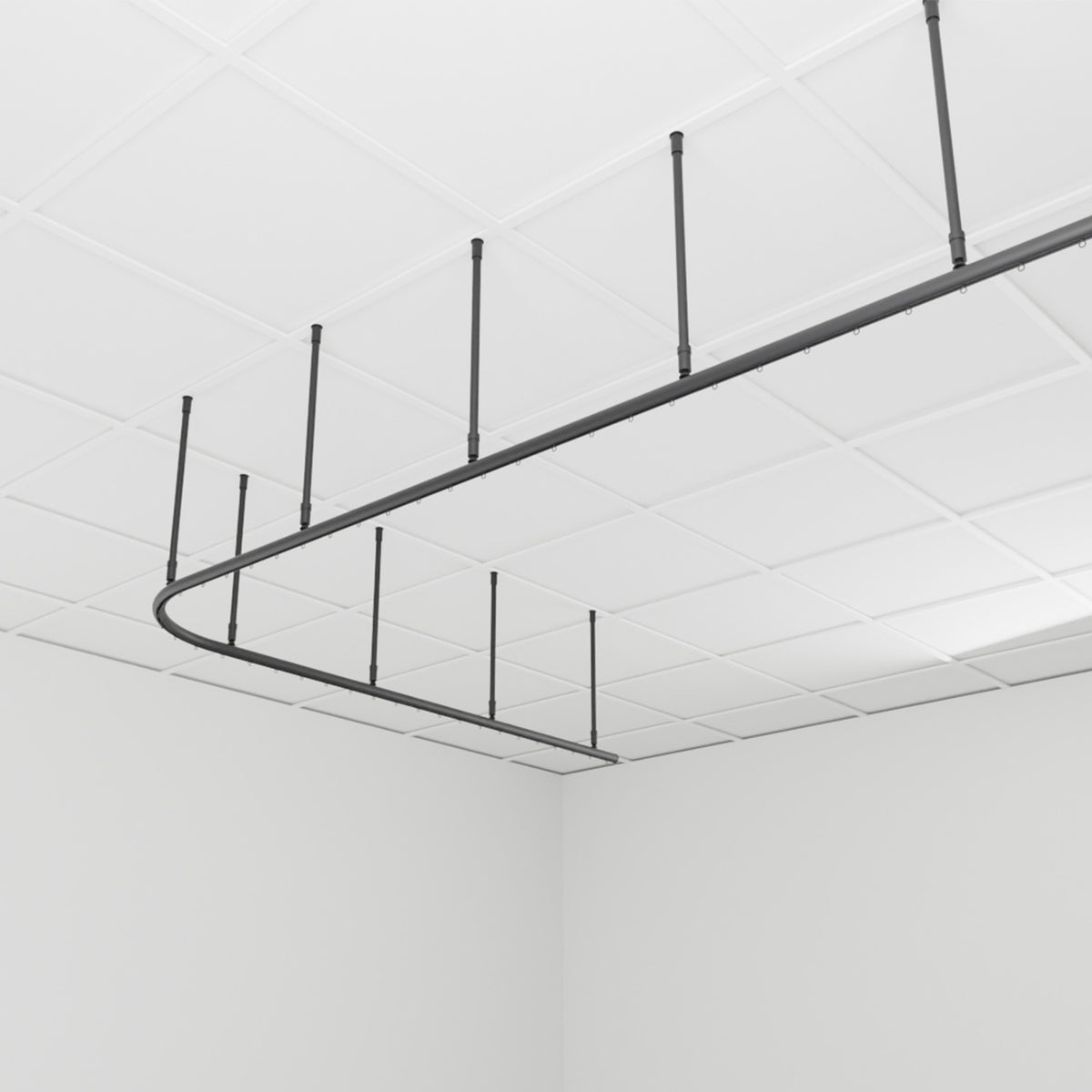 Zone L dividing curtain track suspended from the ceiling on drop tubes