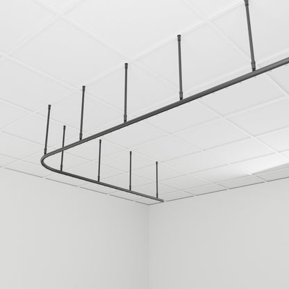 Zone L dividing curtain track suspended from the ceiling on drop tubes