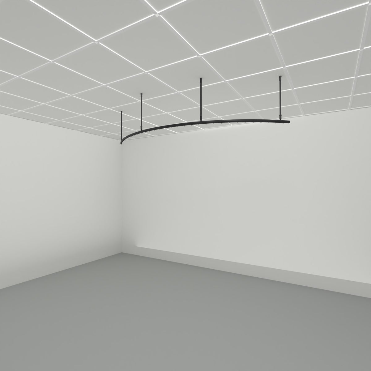 Zone A quarter arc dividing curtain track suspended from a grid ceiling on drop tubes