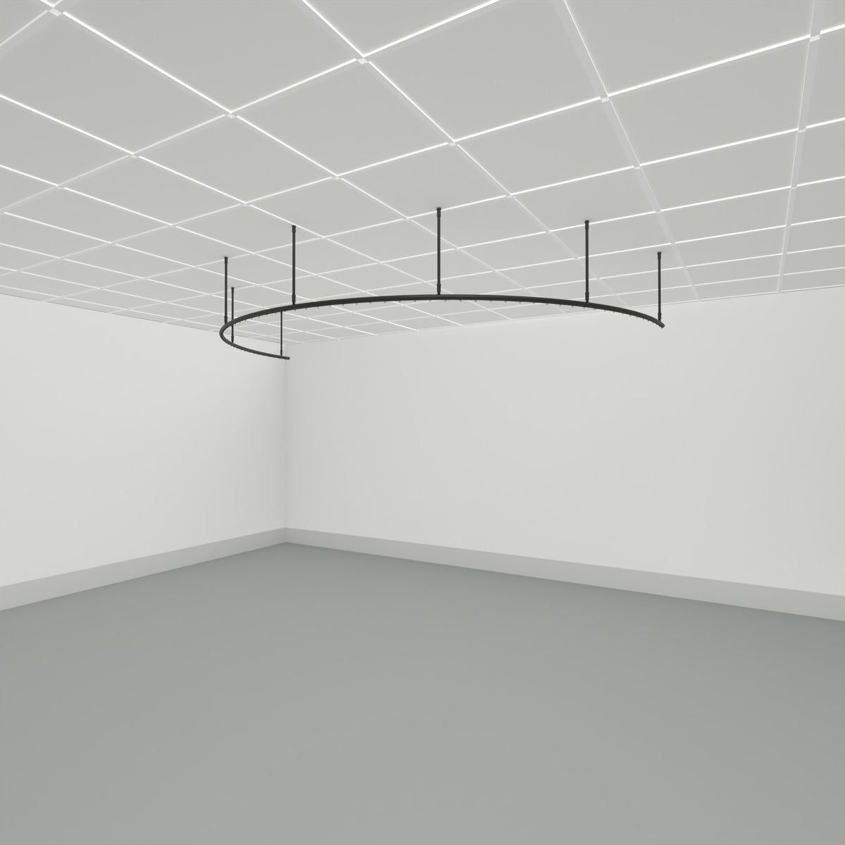 Zone C half circle dividing curtain track suspended from a grid ceiling on drop tubes