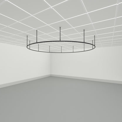 Zone O full circle dividing curtain track suspended from a grid ceiling on drop tubes