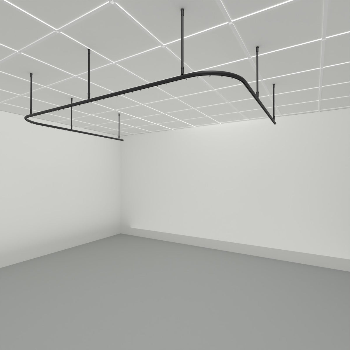 Zone U dividing curtain track suspended from a grid ceiling on drop tubes